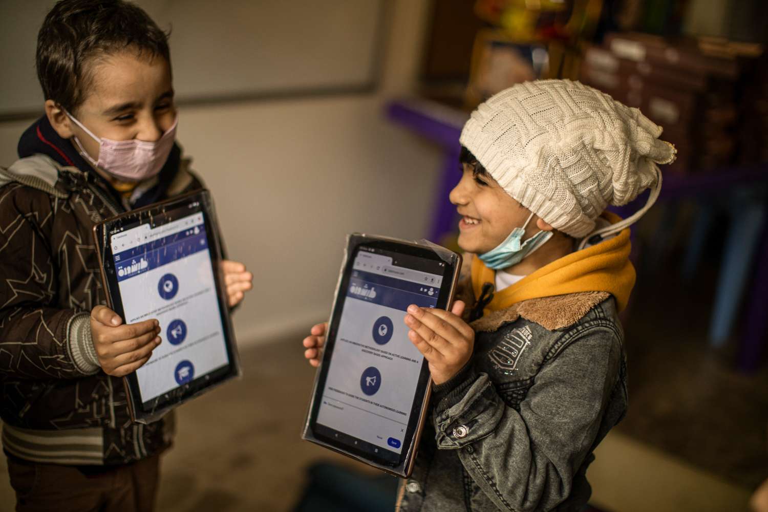 Students using tablets in a classroom as part of a digital learning program