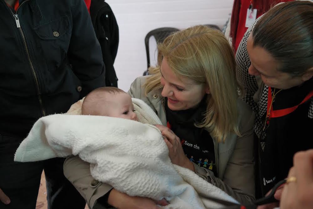 Helle Thorning Schmidt Ceo Of Save The Children Holds A Baby At The Zaatari Refugee Camp In Jordan