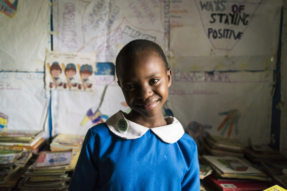 A Student Stands In The Library Of The Kibera School For Girls In Nairobi Kenya
