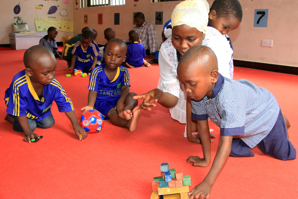 Children At A Brac Play Lab In Tanzania Are Play With Wooden Blocks