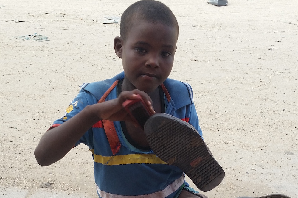 Somali Child Labourer Abdifitah Ahmed Nor Shining Shoes