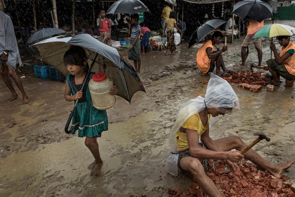 Rohingya Girl Walks In Rain At Unchiprang Refugee Camp At Cox’S Bazar