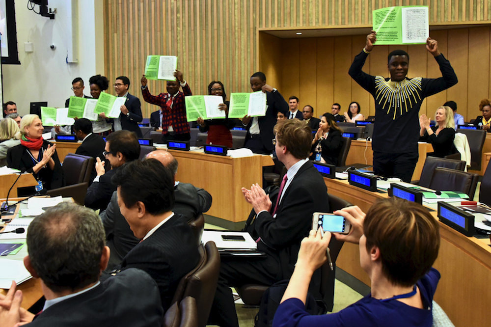 Global Youth Ambassadors Hold Up Iffed Petition Books