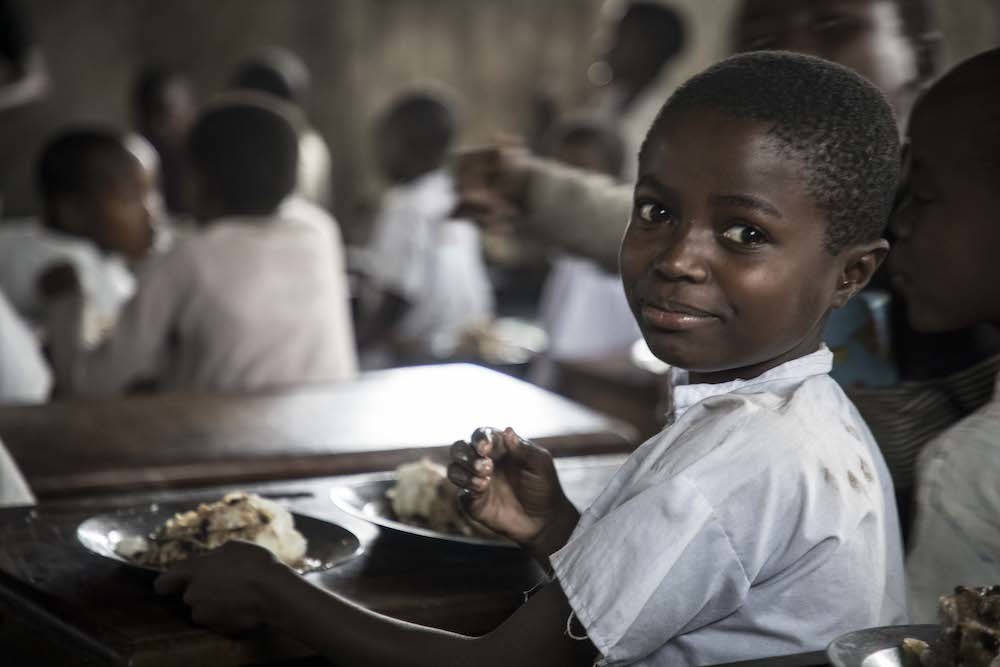 African Child Eating School Meal