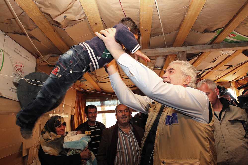 Christos Stylianides With Syrian Refugee Child