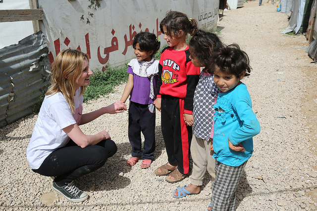 Laura Carmichael speaks to out of school children in Houch El-Oumara tented settlement, Bekaa Vally, Lebanon
