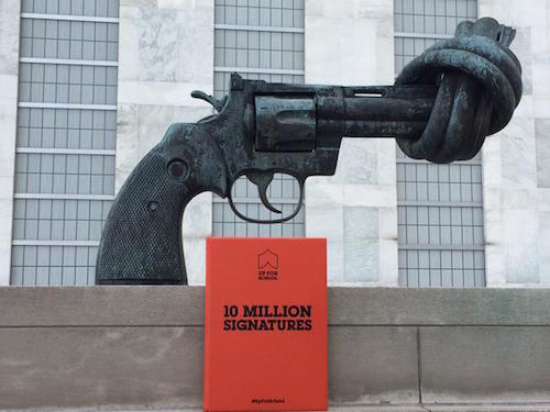 Petition with Non-Violence sculpture outside UN HQ