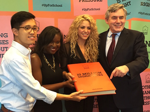 Shakira and Gordon Brown with GYAs Dawnique Shury from Guyana and Benedict Joson from the Philippines