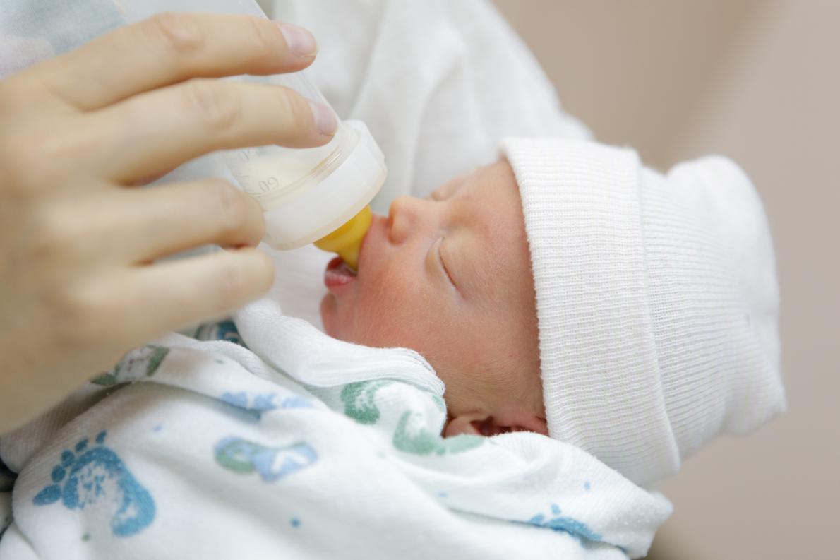 A tiny premature baby is fed milk
