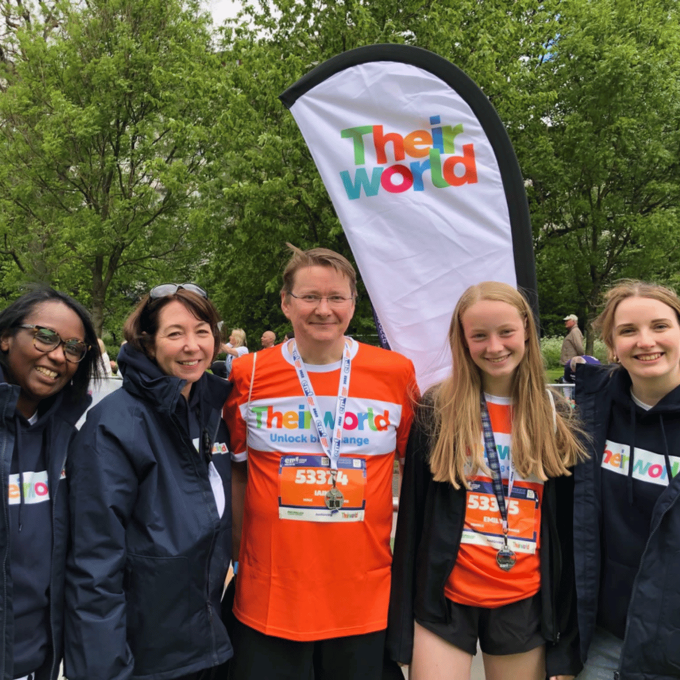 The fundraising team (Jess, Victoria and Emma) with Iain and Emily MacFarlane Runners at the Edinburgh Marathon Festival 2022