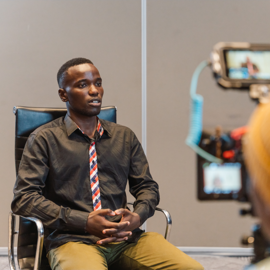 GYA Dan Oiriga is interviewed by videographer Trevor Maingi and Theirworld team member Cara Ghoshal.
