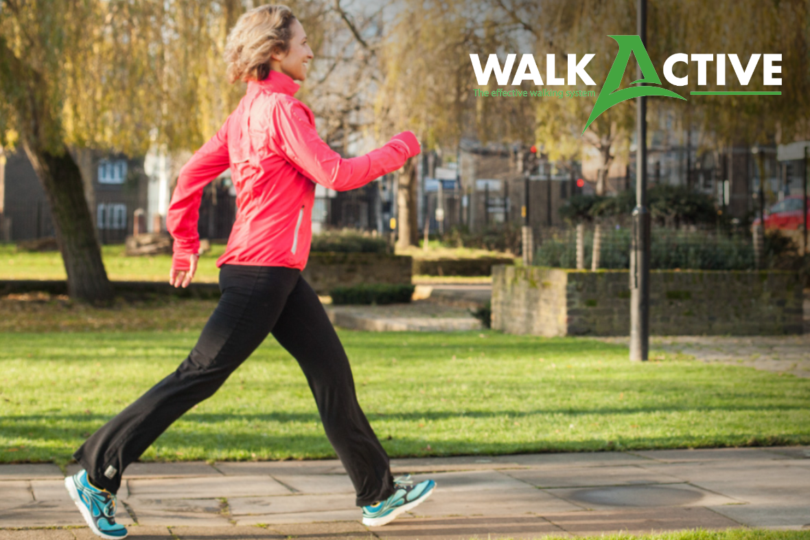 Joanna Hall walking in a park with the WalkActive logo